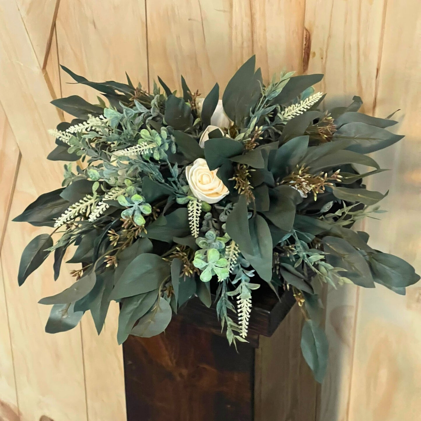 Seeded Eucalyptus and Cream Rose Centerpiece on a Dark Stained Wood Pedestals for Rent - Picture Perfect Rentals Event Rentals in Wichita, KS