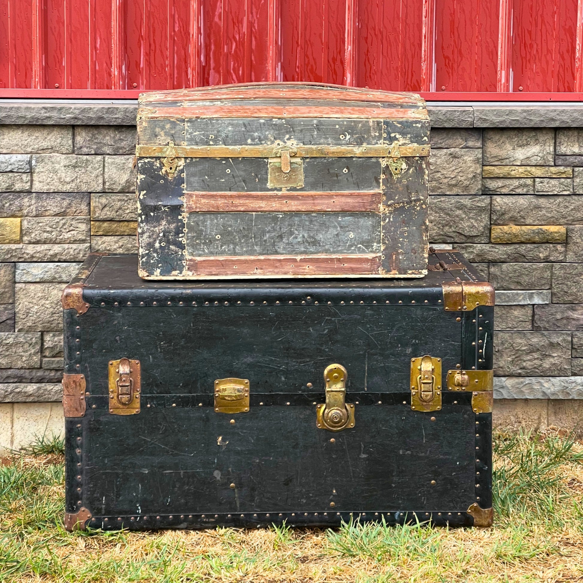 Old Steamer Trunks Stacked on top of each other for a party rental - Picture Perfect Rentals