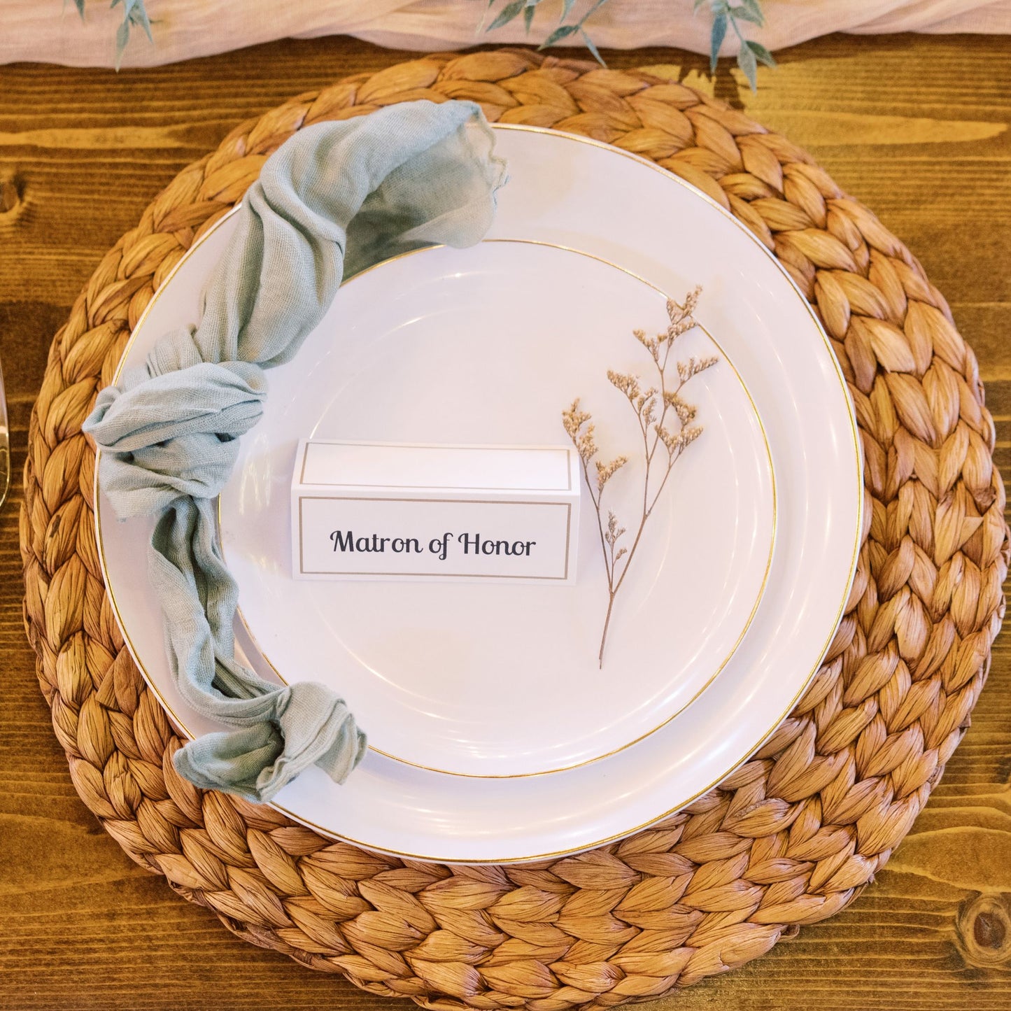 Woven charge & sage green cheesecloth napkin place setting rentals - Picture Perfect Rentals