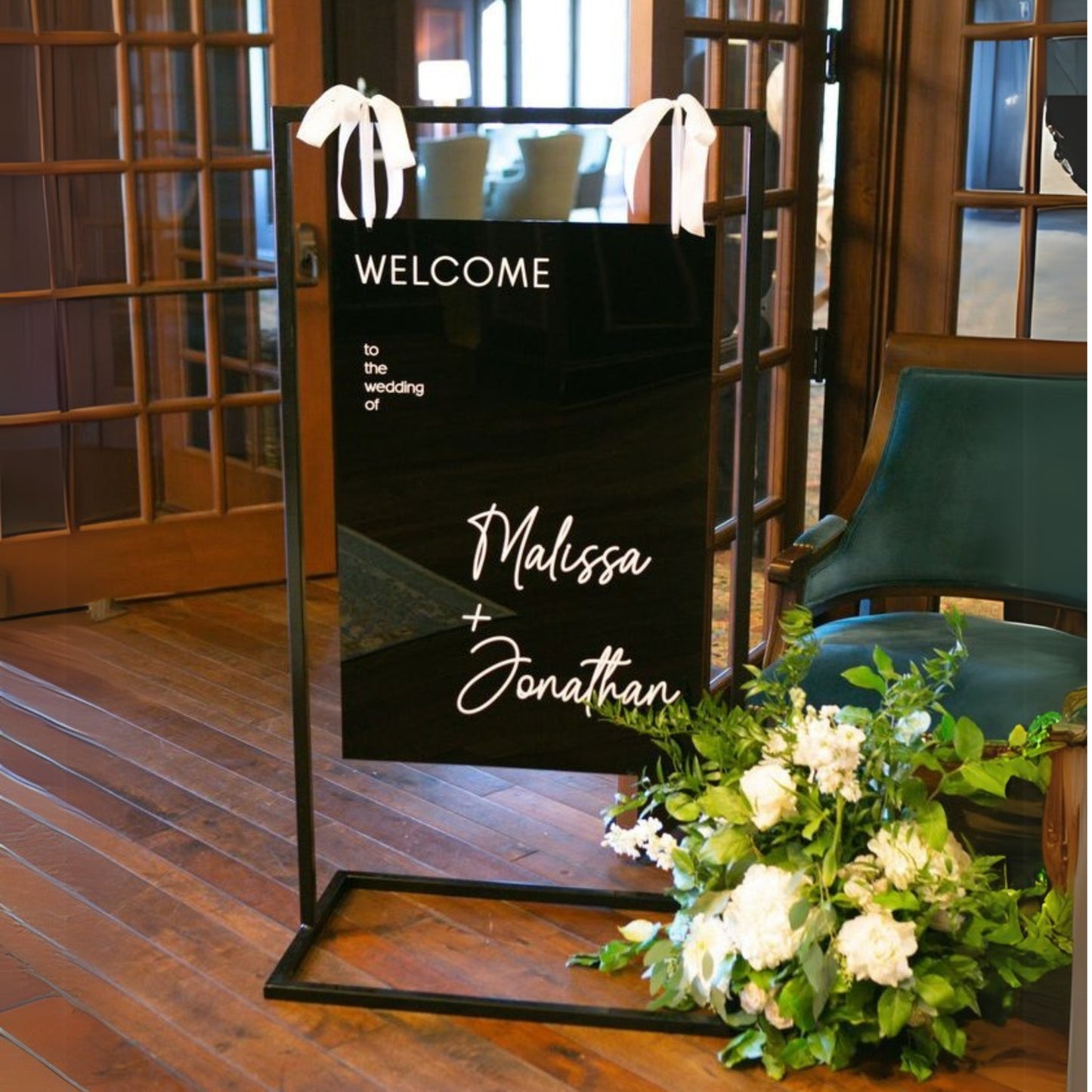 Hanging Sign Holder with a black acrylic welcome sign displayed - Picture Perfect Rentals Wichita, KS