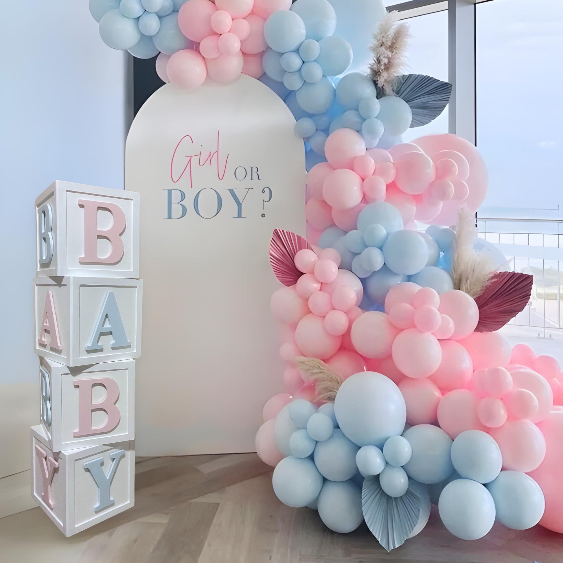 Gender Reveal wood baby blocks with an arched backdrop behind it for rent - Picture Perfect Rentals