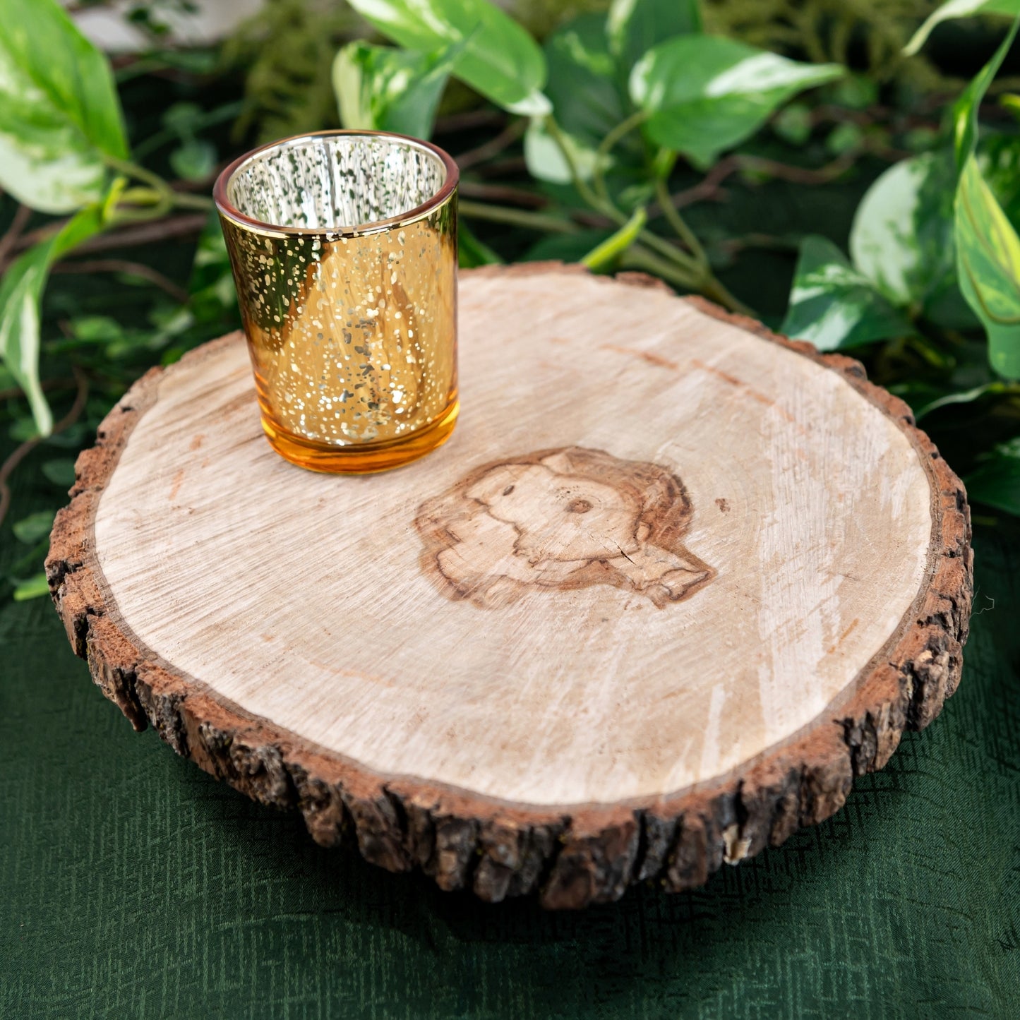 Wood Round on a green cloth with candle holder, wedding rentals in Wichita, Kansas - Picture Perfect Rentals 